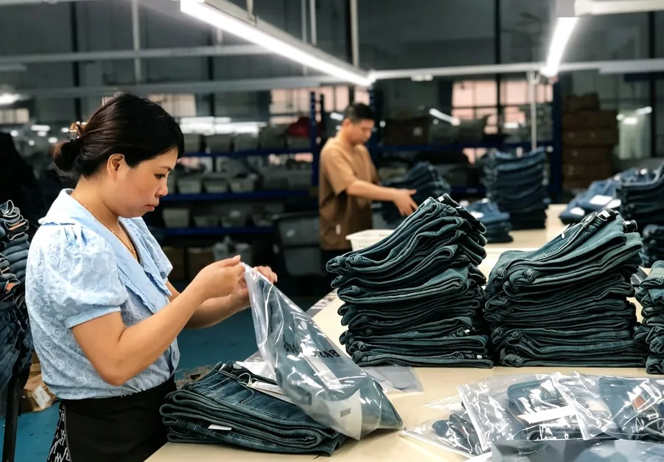 Finished denim garments being packed